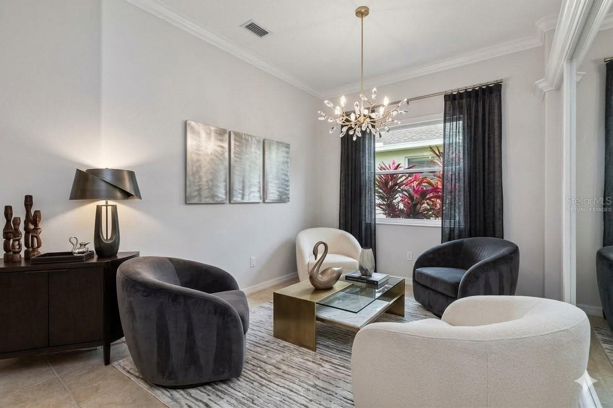 Formal dining room which can be subbed out for a library or lounge area...virtually staged - 8150 INDIGO RIDGE TER, UNIVERSITY PARK