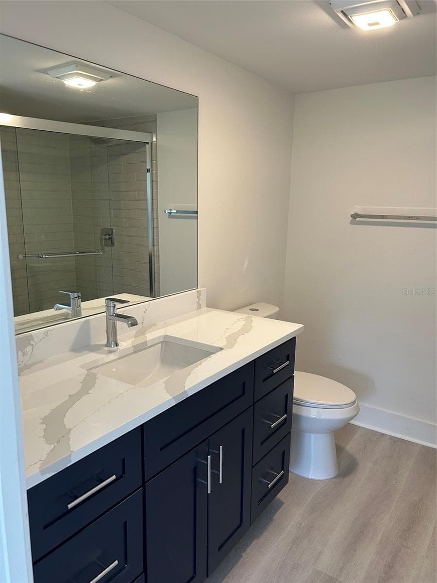Ensuite bathroom in Primary Bedroom (shower stall reflected in the mirror. - 4520 OVERLOOK DR NE #132, ST PETERSBURG