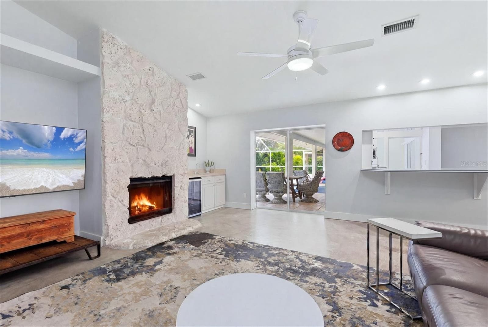 Stunning Floor-to-Ceiling Stone Fireplace - 3900 TORREY PINES BLVD, SARASOTA