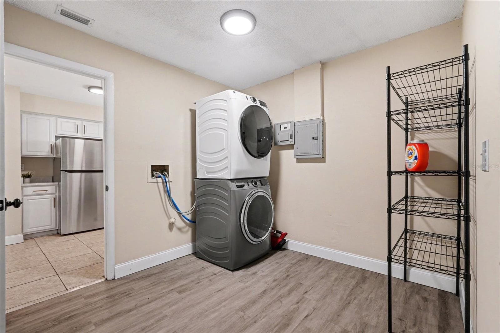 An oversized inside laundry room provides extra storage and everyday convenience. - 5733 66TH LN N, ST PETERSBURG