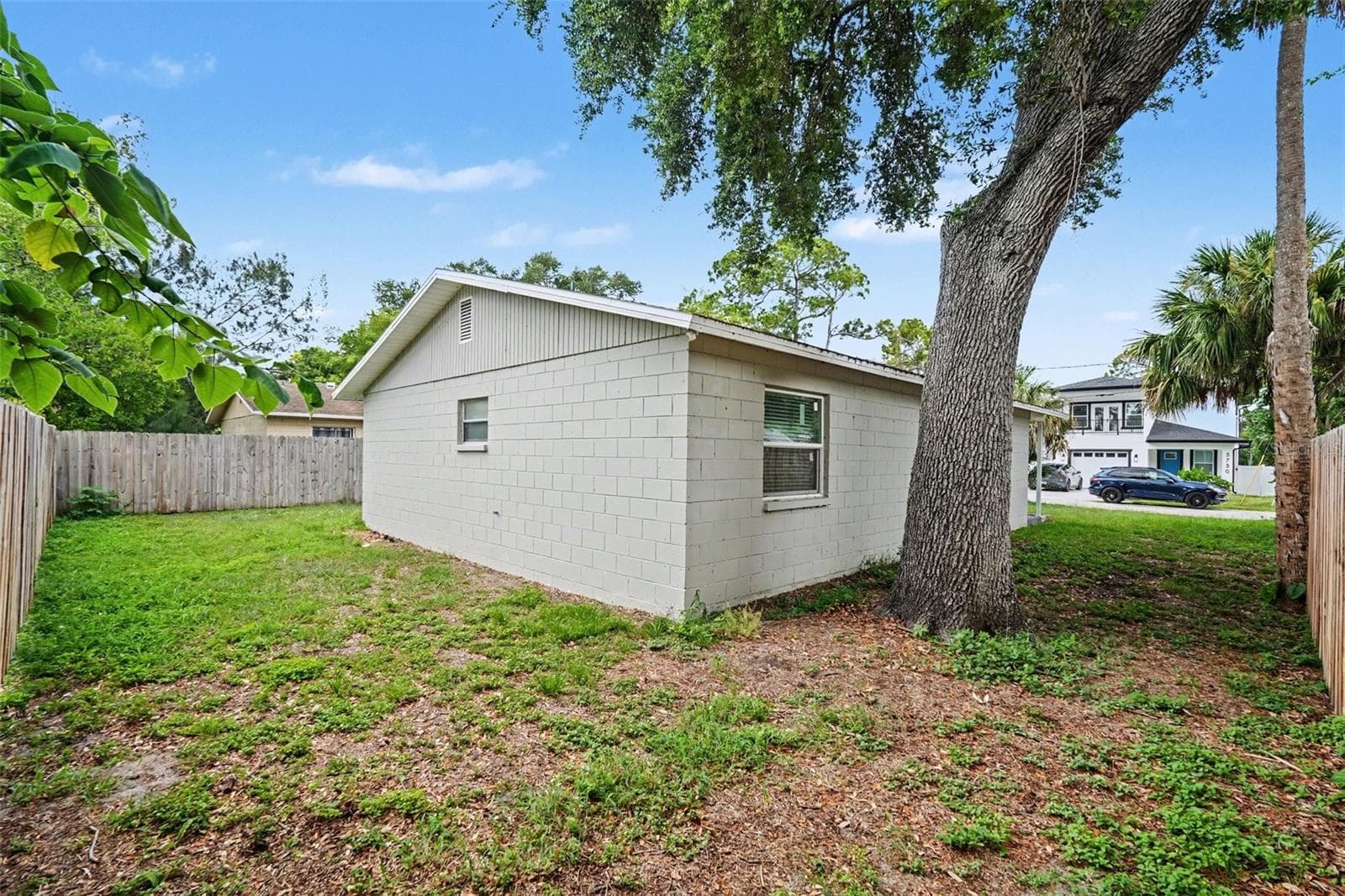 Additional side yard space provides even more room for pets, recreation, or storage. - 5733 66TH LN N, ST PETERSBURG
