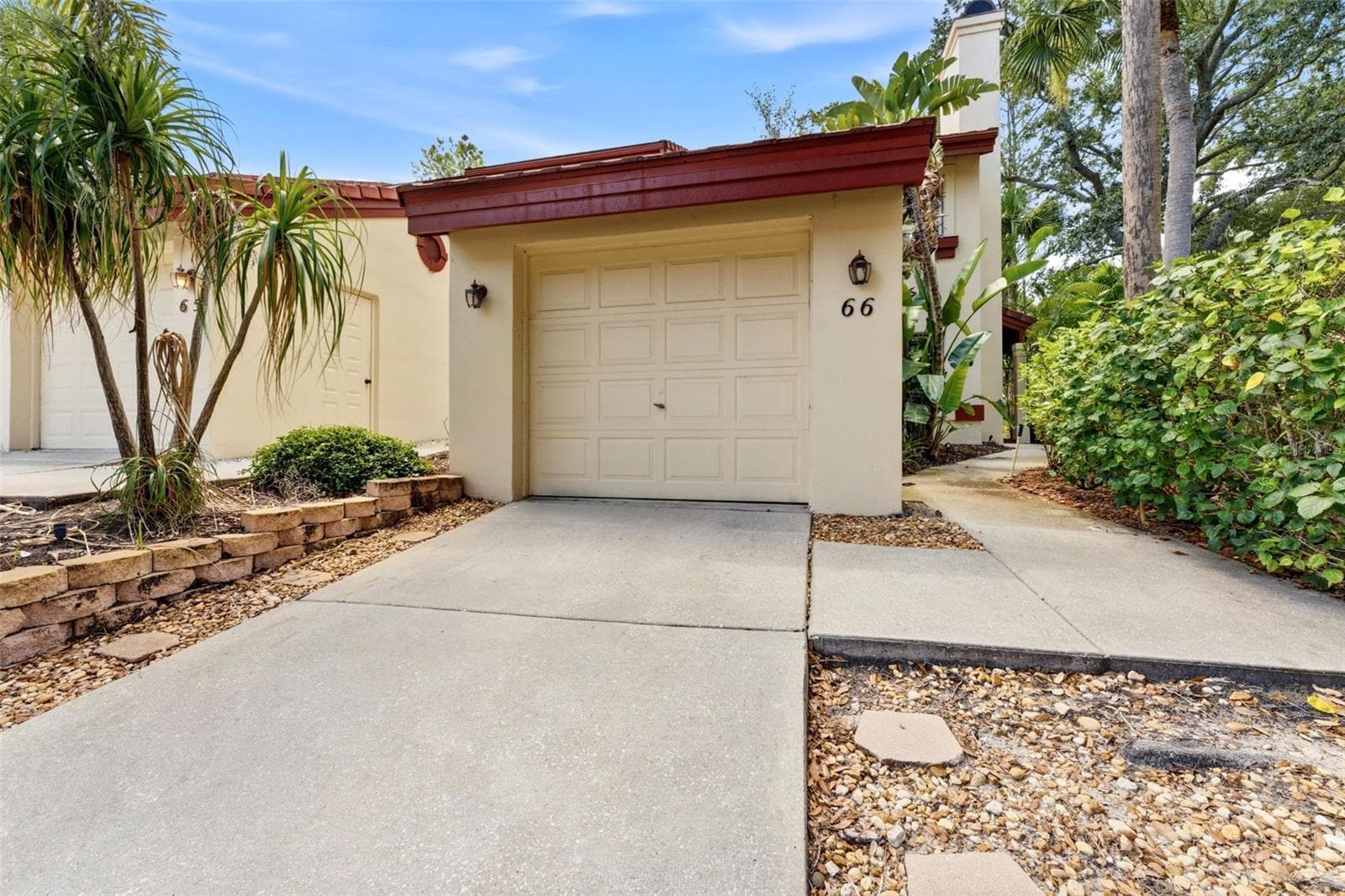 Garage entrance sidewalk on the right to the front door - 3460 COUNTRYSIDE BLVD #66, CLEARWATER