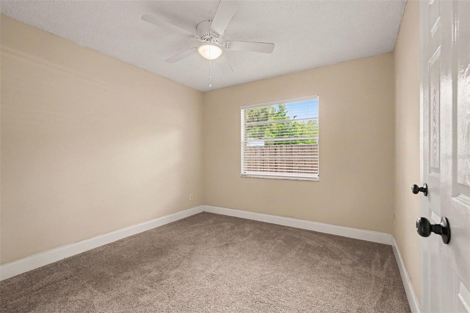 The third bedroom offers flexibility as a home office, hobby room, or guest space. - 5733 66TH LN N, ST PETERSBURG