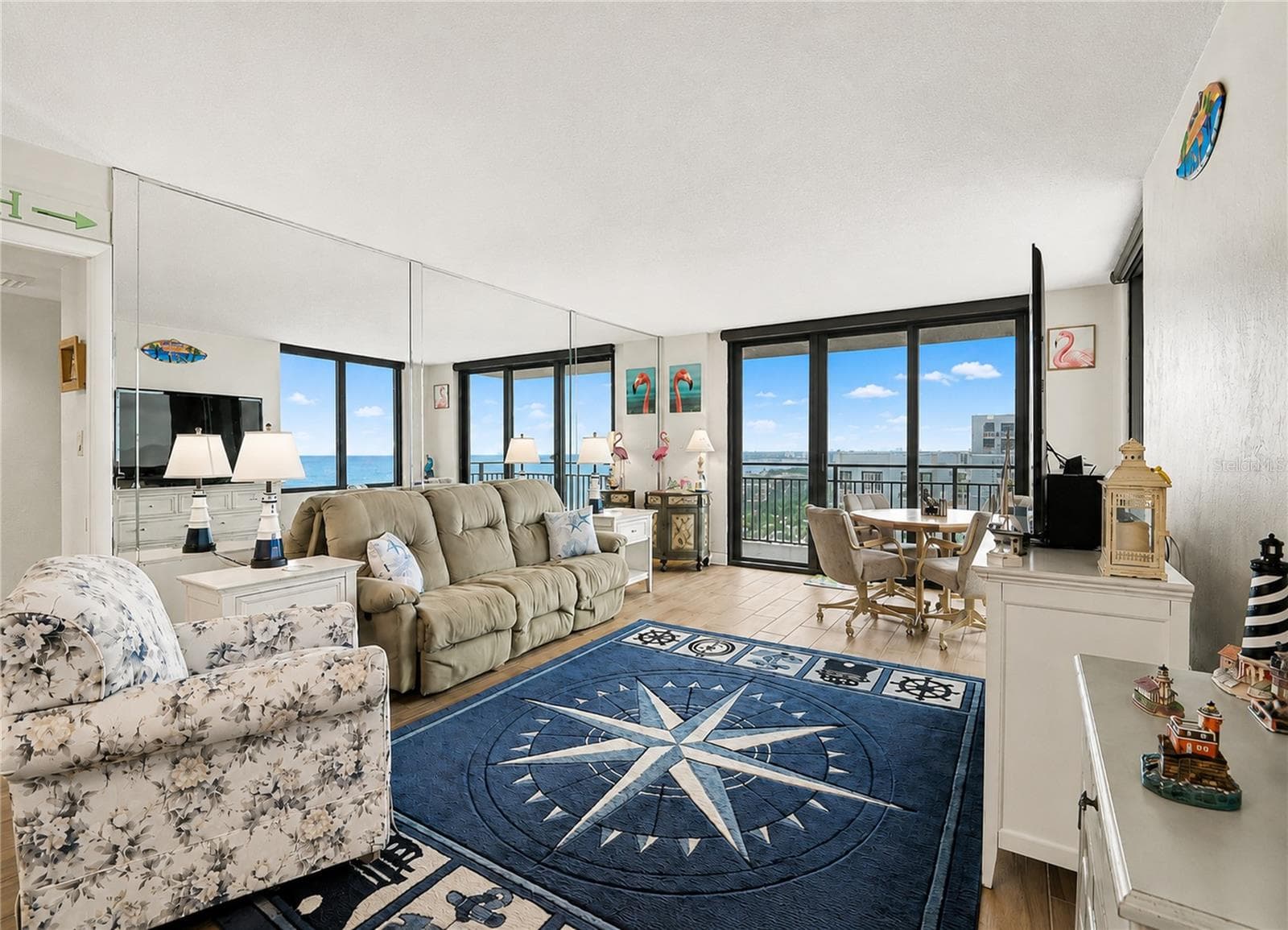 Living Room offering electric shades for privacy. - 3051 S ATLANTIC AVE #V060, DAYTONA BEACH SHORES