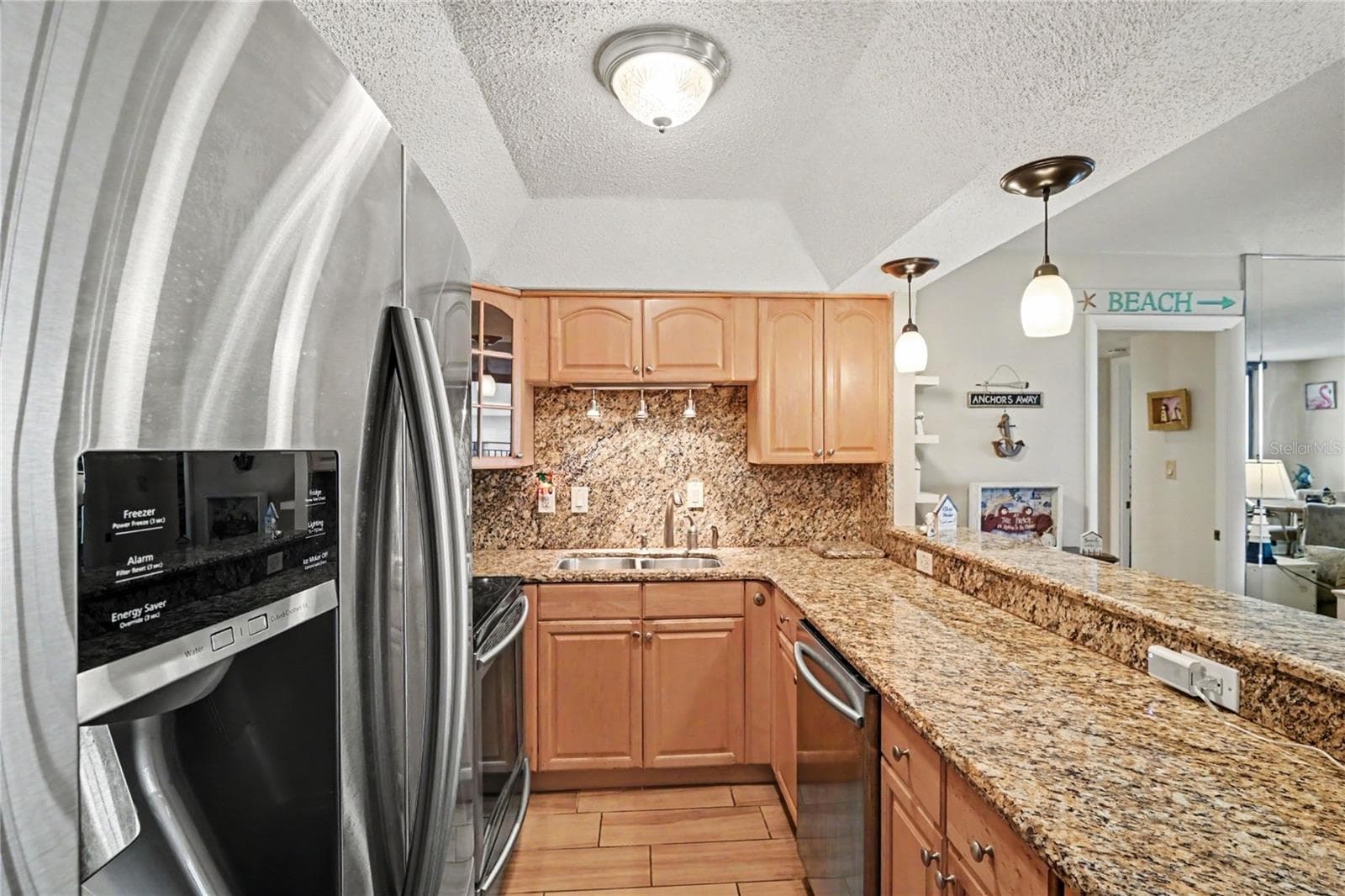 Kitchen has been remodeled opening it up to have full view of the living room and views. - 3051 S ATLANTIC AVE #V060, DAYTONA BEACH SHORES