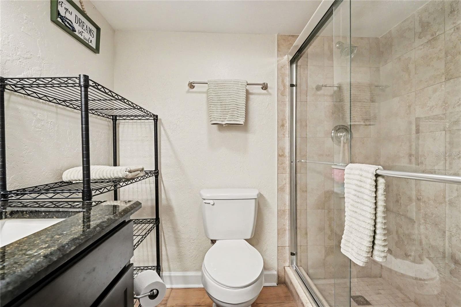 Primary bath with walk-in shower. - 3051 S ATLANTIC AVE #V060, DAYTONA BEACH SHORES