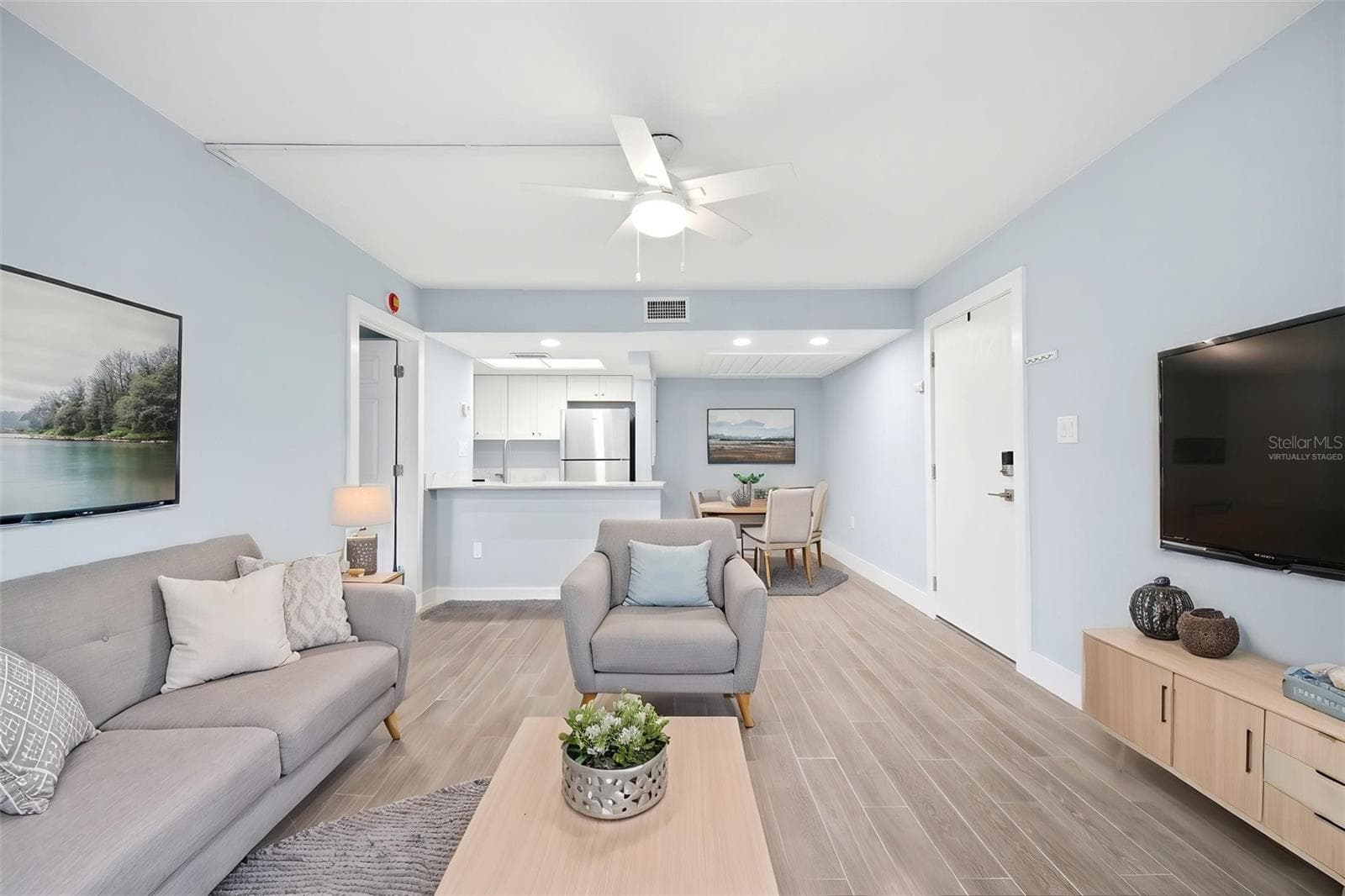 Living Room and Dining Areas Virtually Staged - 5242 OPAL LN #104, NEW PORT RICHEY