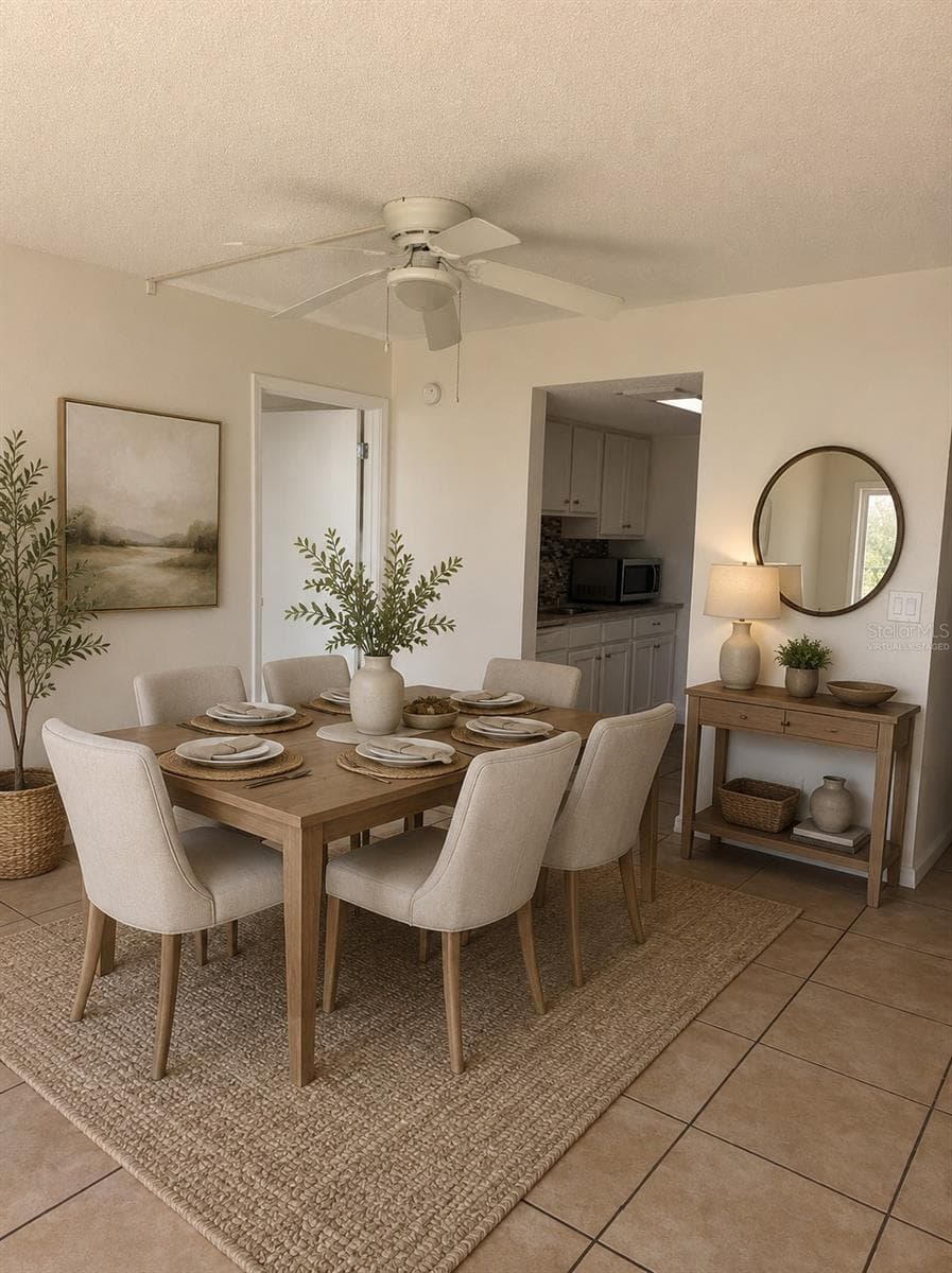 Virtually staged dining area - 3580 S OCEAN SHORE BLVD #101, FLAGLER BEACH