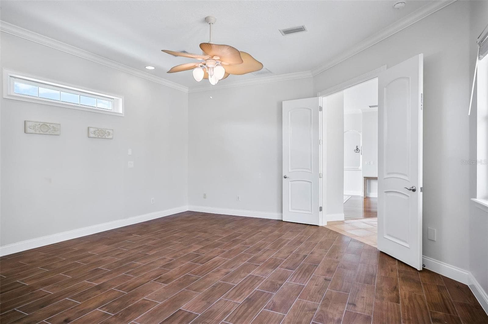 Spacious Primary bedroom with tile flooring throughout - 88 HIDDEN CV, FLAGLER BEACH