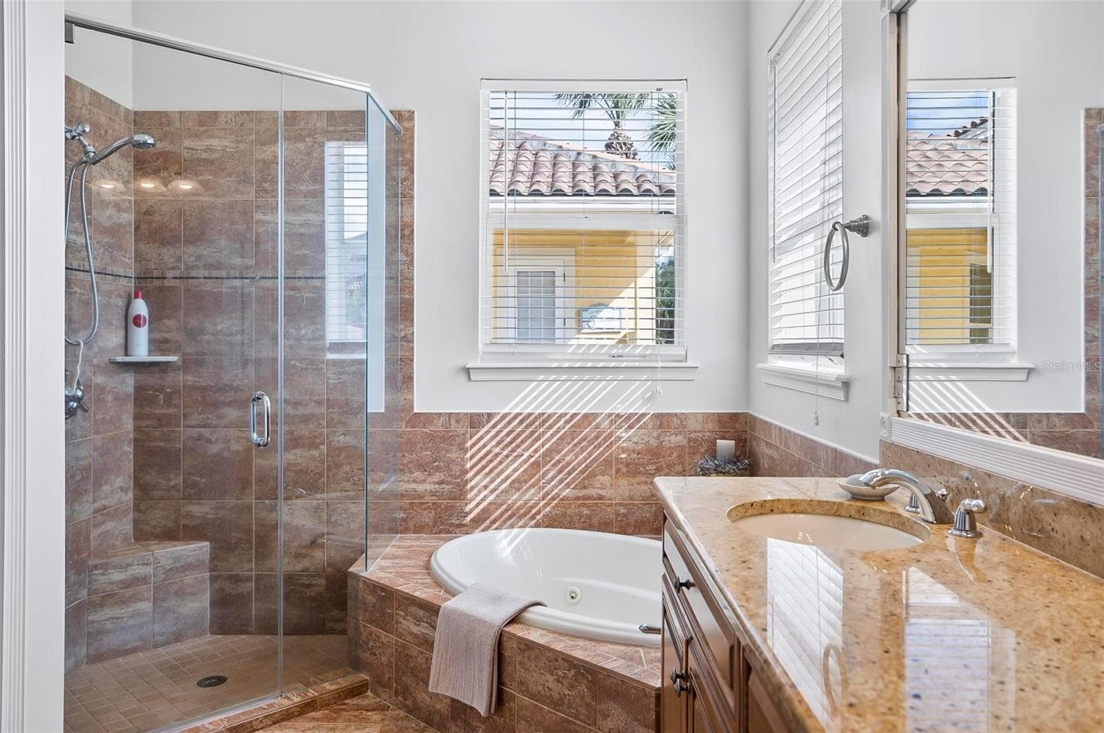 Primary bedroom bathroom with shower and jacuzzi tub - 88 HIDDEN CV, FLAGLER BEACH