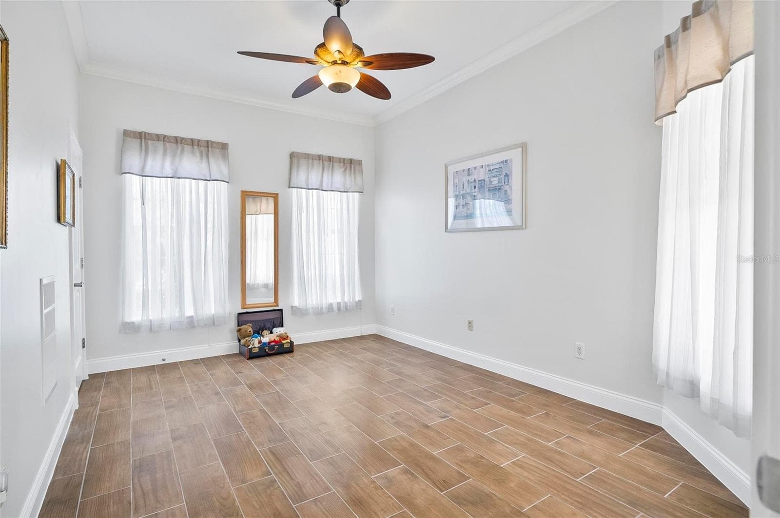 Bedroom 2 overlooking courtyard with tile flooring - 88 HIDDEN CV, FLAGLER BEACH
