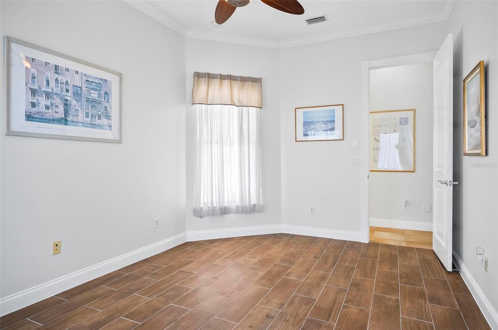 Bedroom 2 overlooking courtyard with tile flooring - 88 HIDDEN CV, FLAGLER BEACH