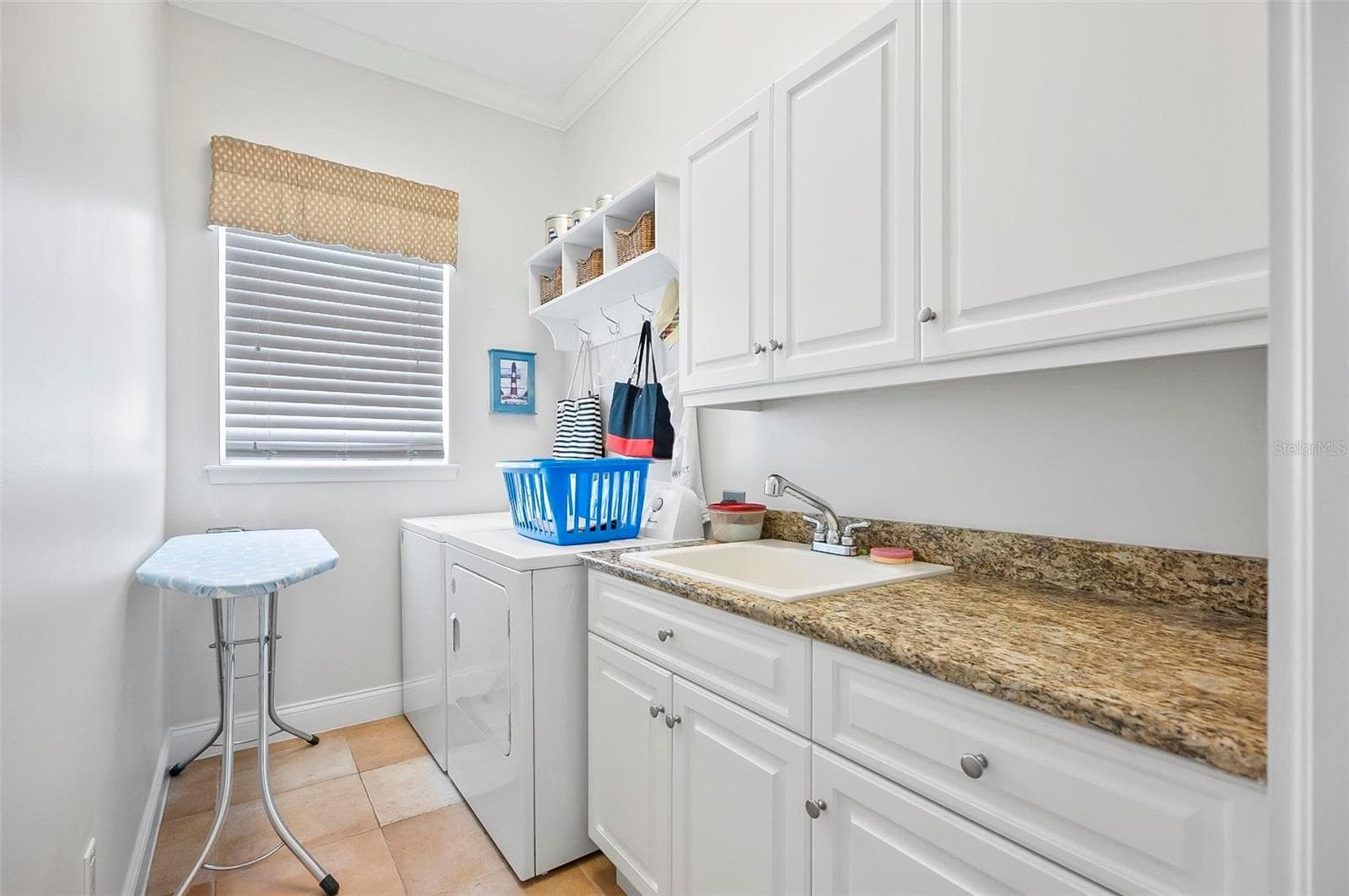 Laundry room with pocket door - 88 HIDDEN CV, FLAGLER BEACH