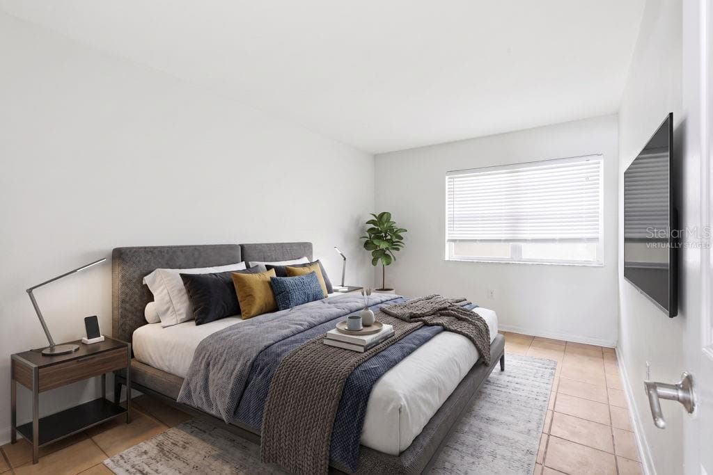 bedroom furniture is virtually staged - 5876 21ST ST N #5, ST PETERSBURG