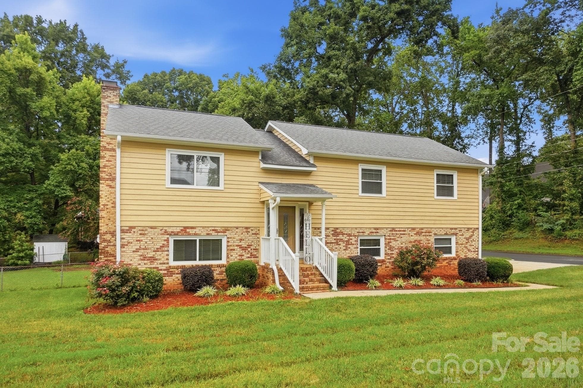 This split-level home is situated on a large, level corner lot - 2600 Providence Drive, Gastonia