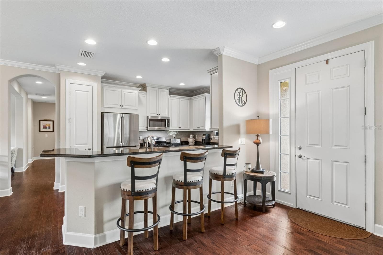 Granite island with additional seating - 11503 CALLISIA DR, ODESSA