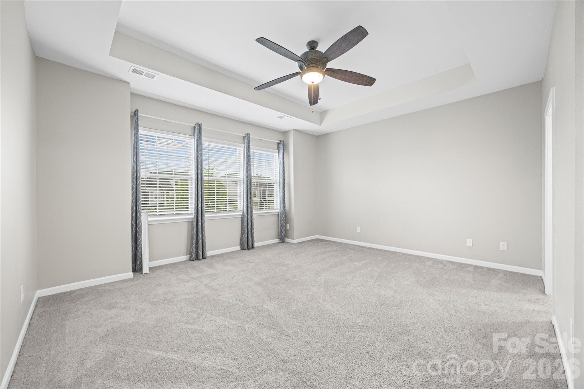 Primary Bedroom with large windows and natural light - 623 Amber Meadows Way, Fort Mill