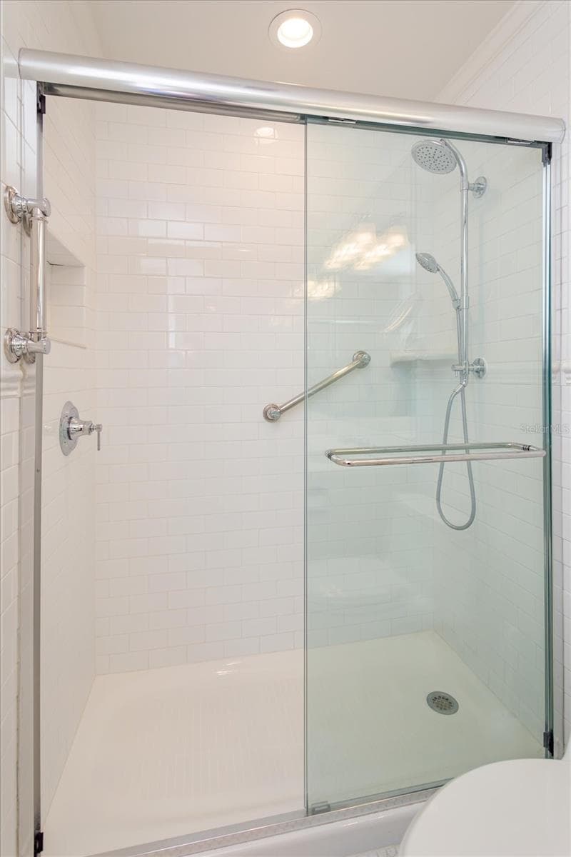 Primary Bath updated step in shower, tile, glass door, faucet - 5019 GRAN LAC AVE, ORLANDO