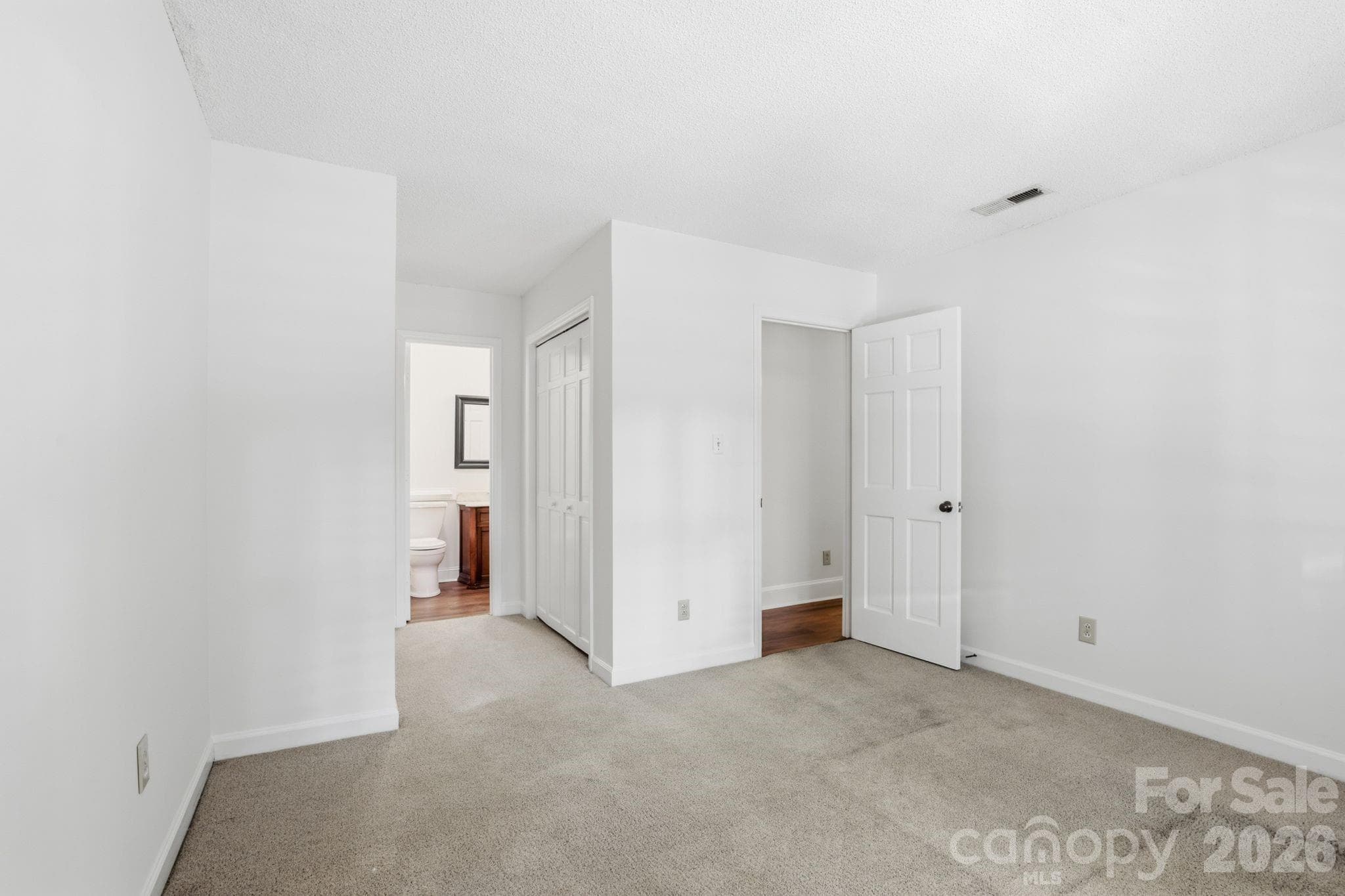First floor primary bedroom with ensuite bath - 2500 Round Table Road, Monroe