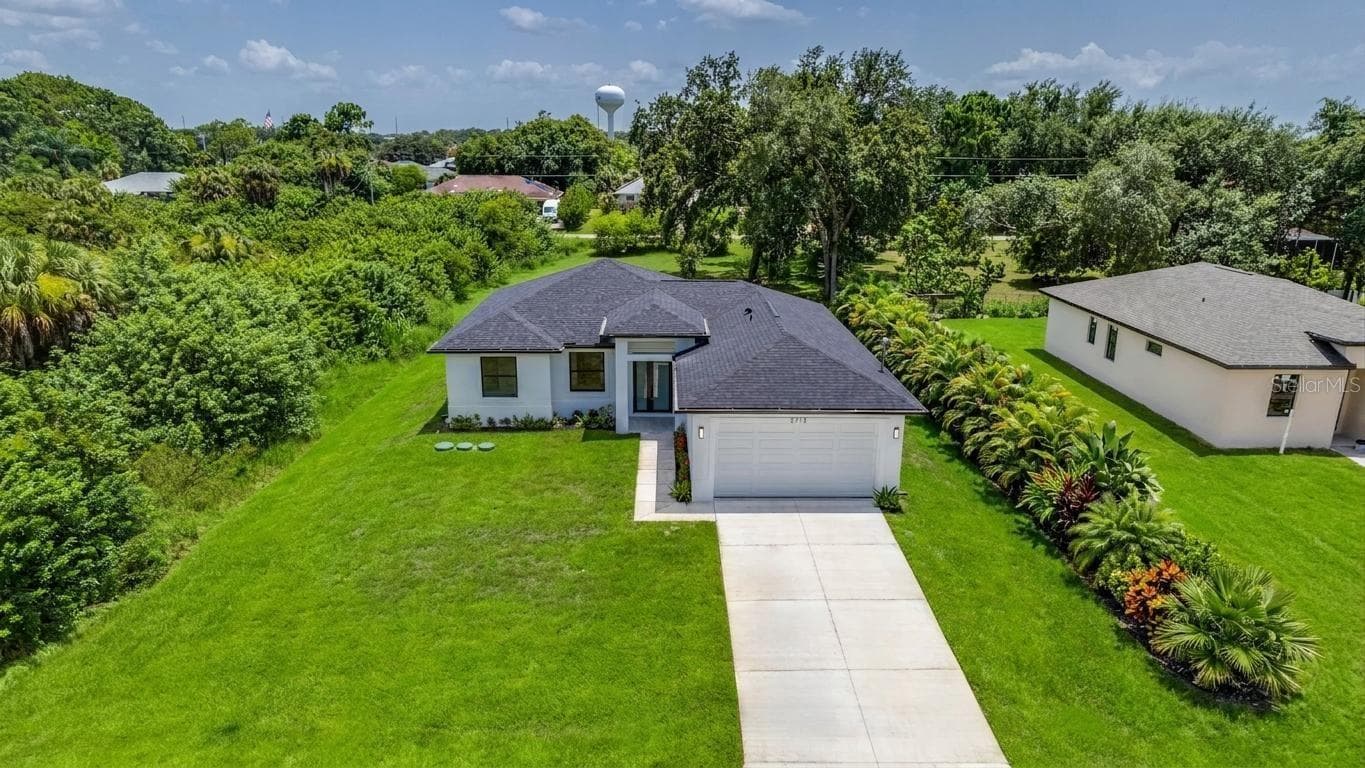 Nice yard front & back! (Virtually enhanced) - 2713 8TH ST W, LEHIGH ACRES