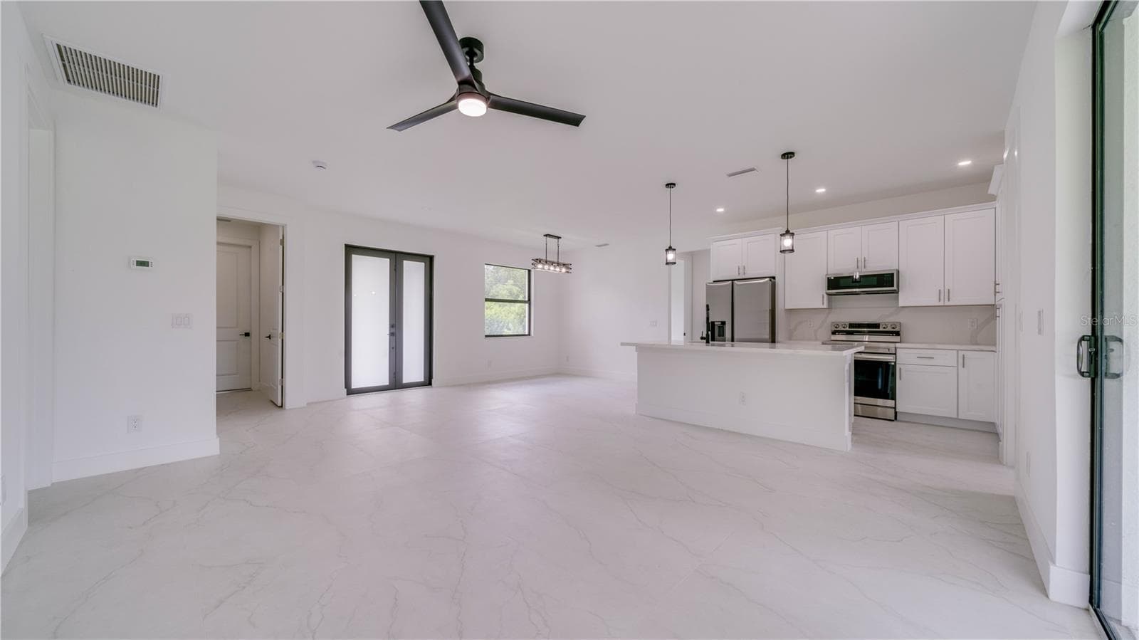 Double front door entry! Gorgeous tile flooring throughout! - 2713 8TH ST W, LEHIGH ACRES