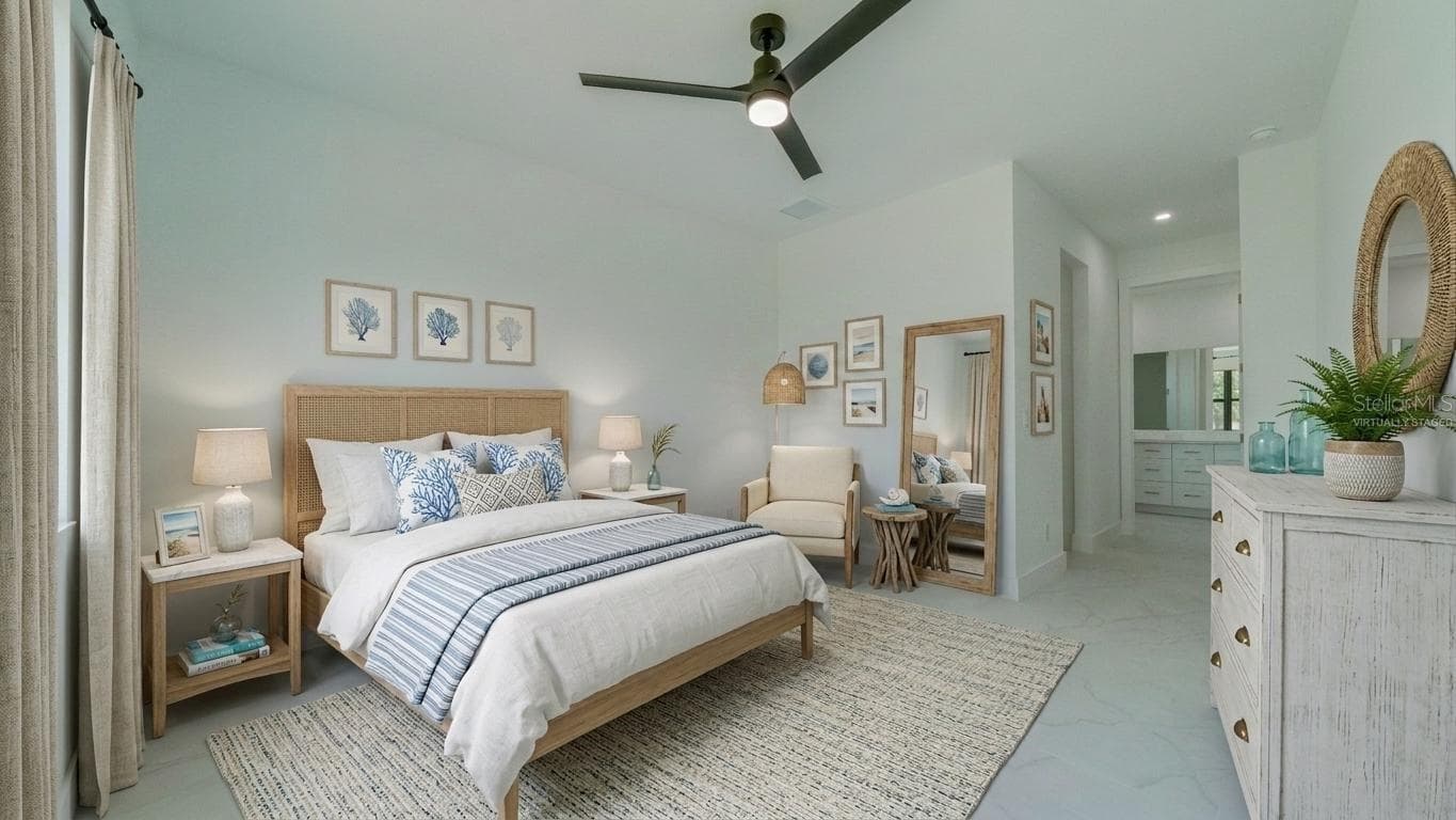 Primary bedroom with 2 walk-in closets and en-suite. (Virtually staged) - 2713 8TH ST W, LEHIGH ACRES