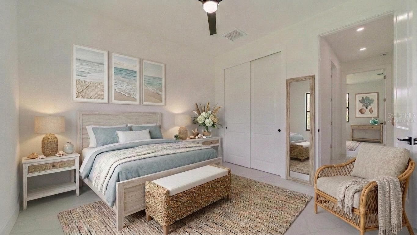 Front guest Bedroom (Virtually Staged) Hallway behind chair leads to bathroom & bathroom & another guest bedroom. - 2713 8TH ST W, LEHIGH ACRES