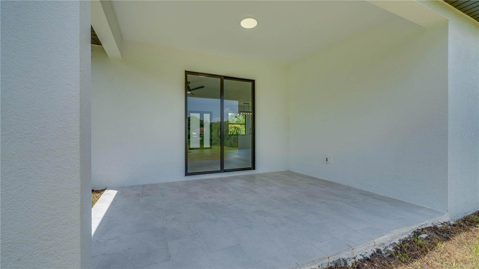 Open covered lanai. - 2713 8TH ST W, LEHIGH ACRES