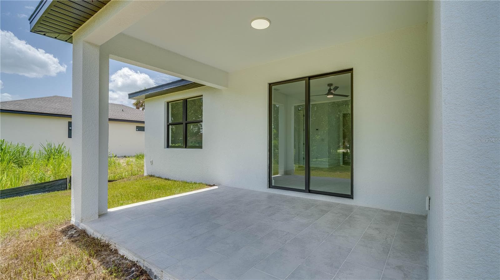 Open covered lanai. - 2713 8TH ST W, LEHIGH ACRES
