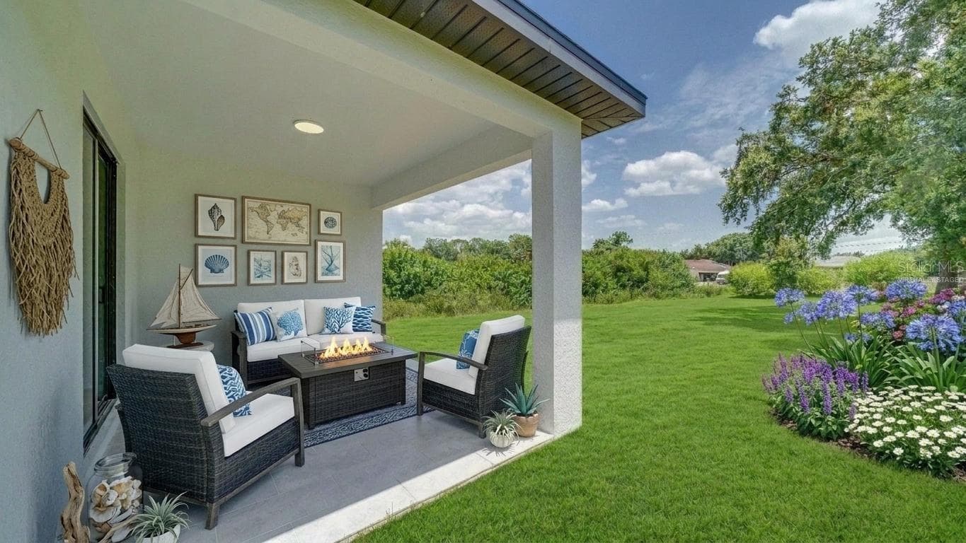 Another view of the lanai and backyard. No neighbor in the back! (Virtually staged & enhanced) - 2713 8TH ST W, LEHIGH ACRES