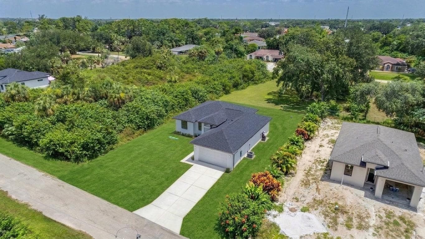 A lot of new construction in the area. (Virtually enhanced) - 2713 8TH ST W, LEHIGH ACRES