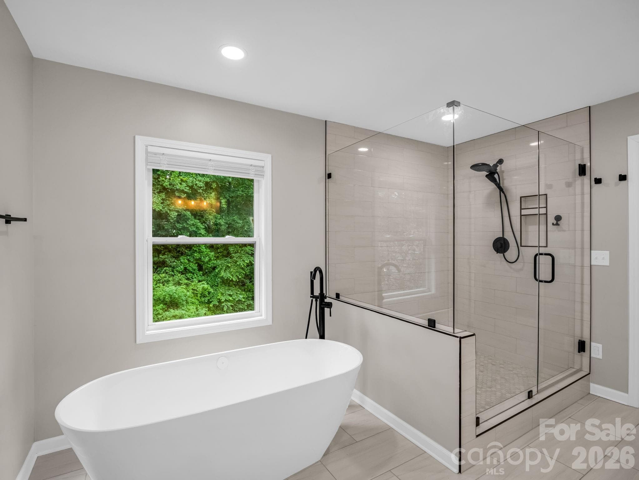 Luxurious soaking tub & spacious walk-in tiled shower with glass - 35 Chastain Hill Road, Mills River