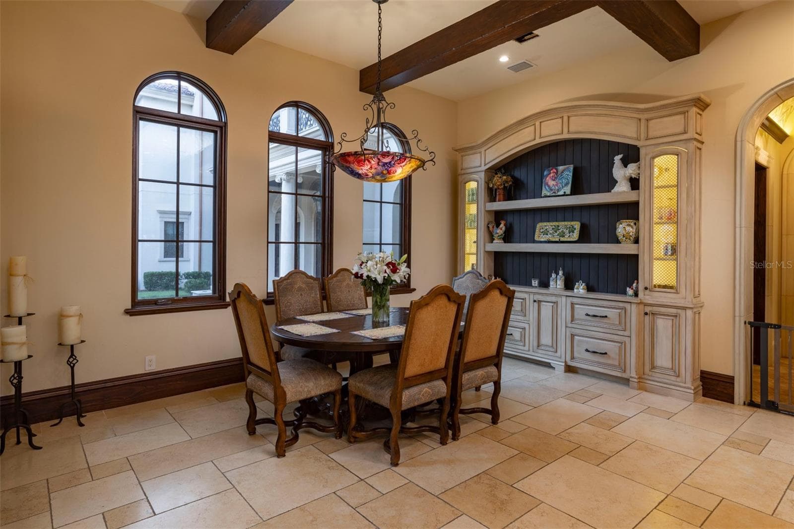 eat in kitchen nook with inset built in details and beamed ceilings - 6119 GROSVENOR SHORE DR, WINDERMERE