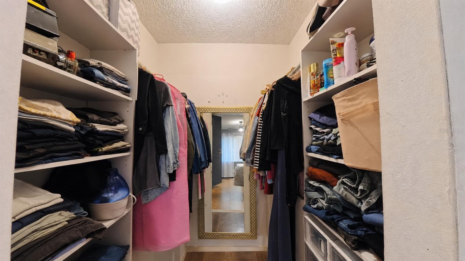 Primary walk-in closet with built-in shelving - 257 CLEMENS CT, ORLANDO