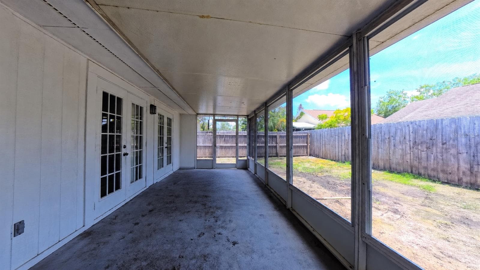 Rear exterior view of the screened porch structure - 257 CLEMENS CT, ORLANDO