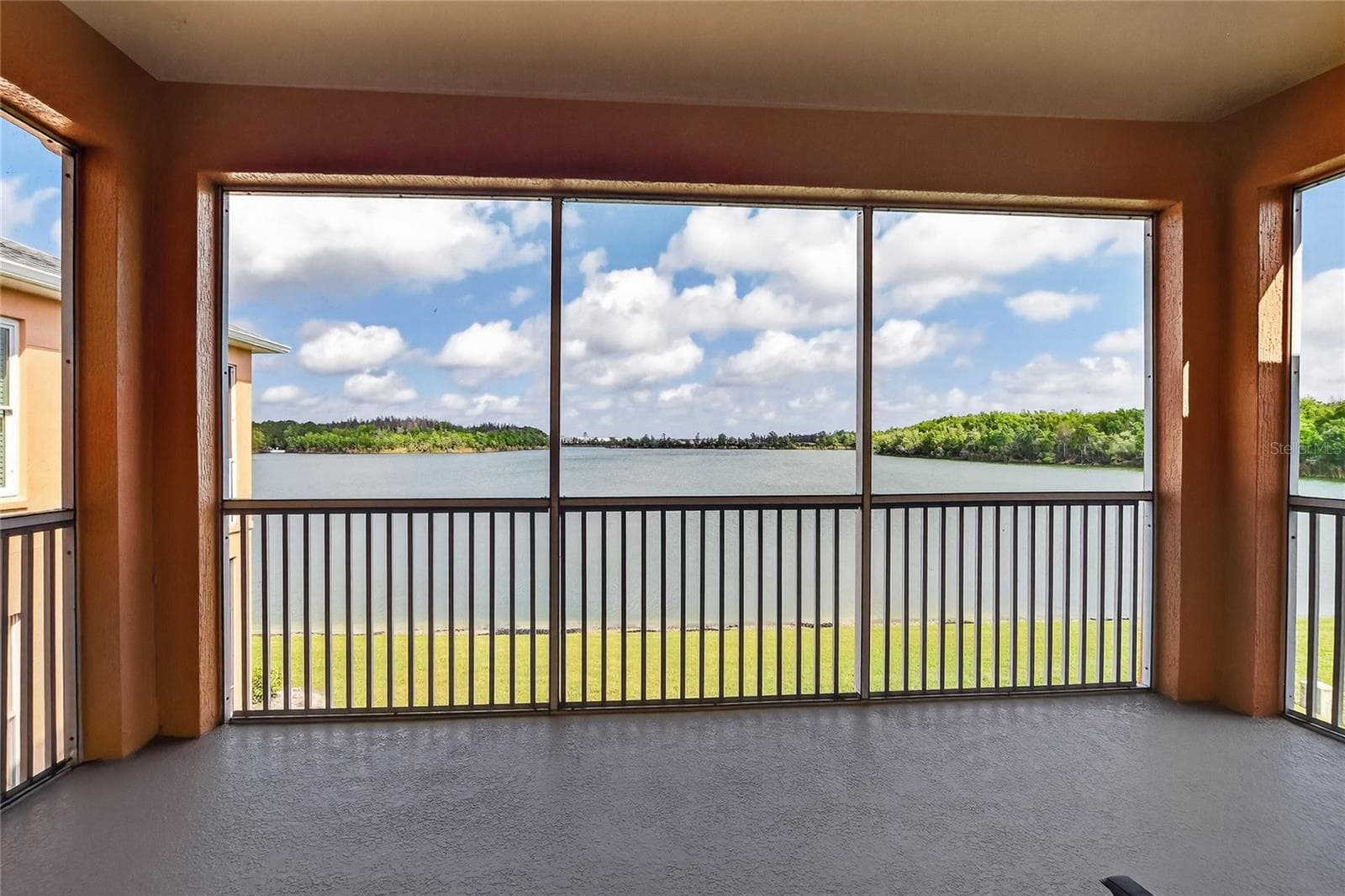 Back Porch Lanai over looking lake - 3933 SERENADE LN, LAKELAND