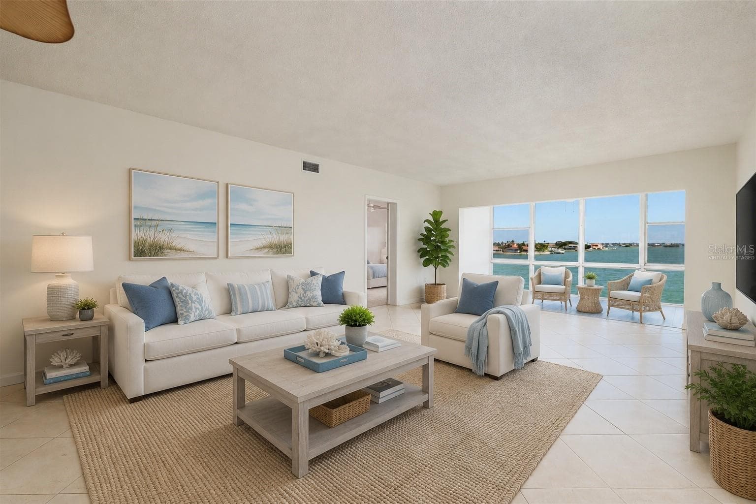 Virtually staged. Living area & Florida room w/Bay views. - 6061 2ND ST E #55, ST PETE BEACH