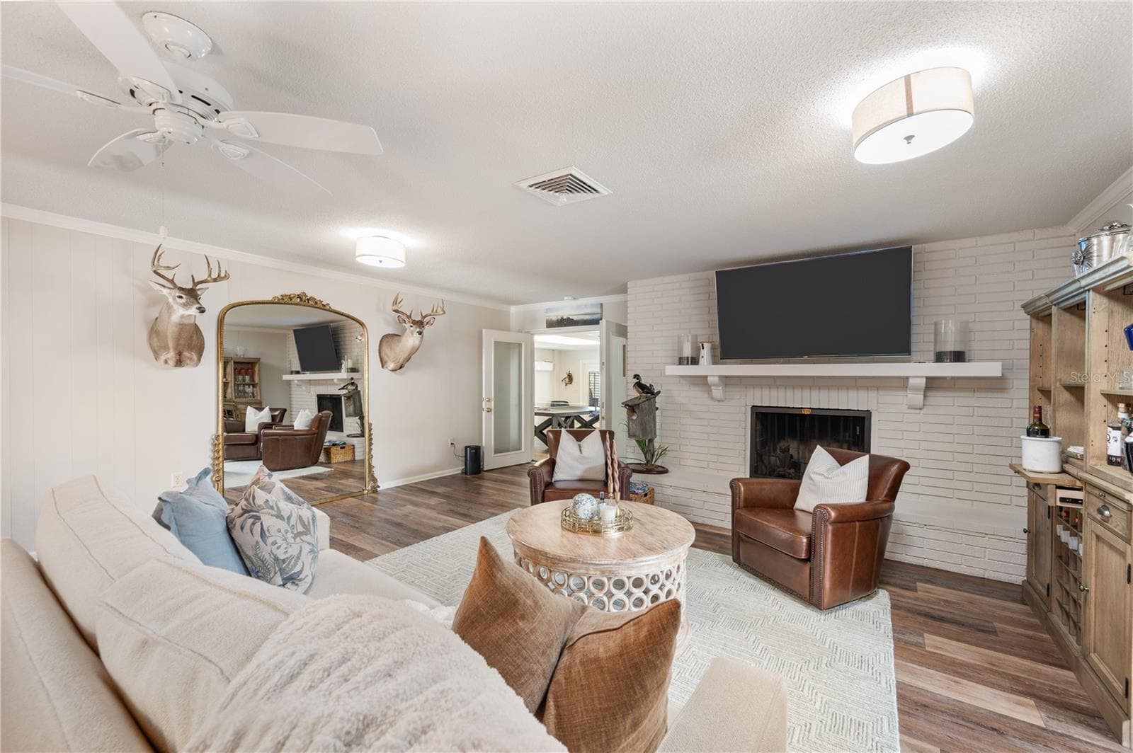 From the family room is the far corner is the entrance to an enormous Game/media/TV-theater room - 1211 HUNT AVE, LAKELAND