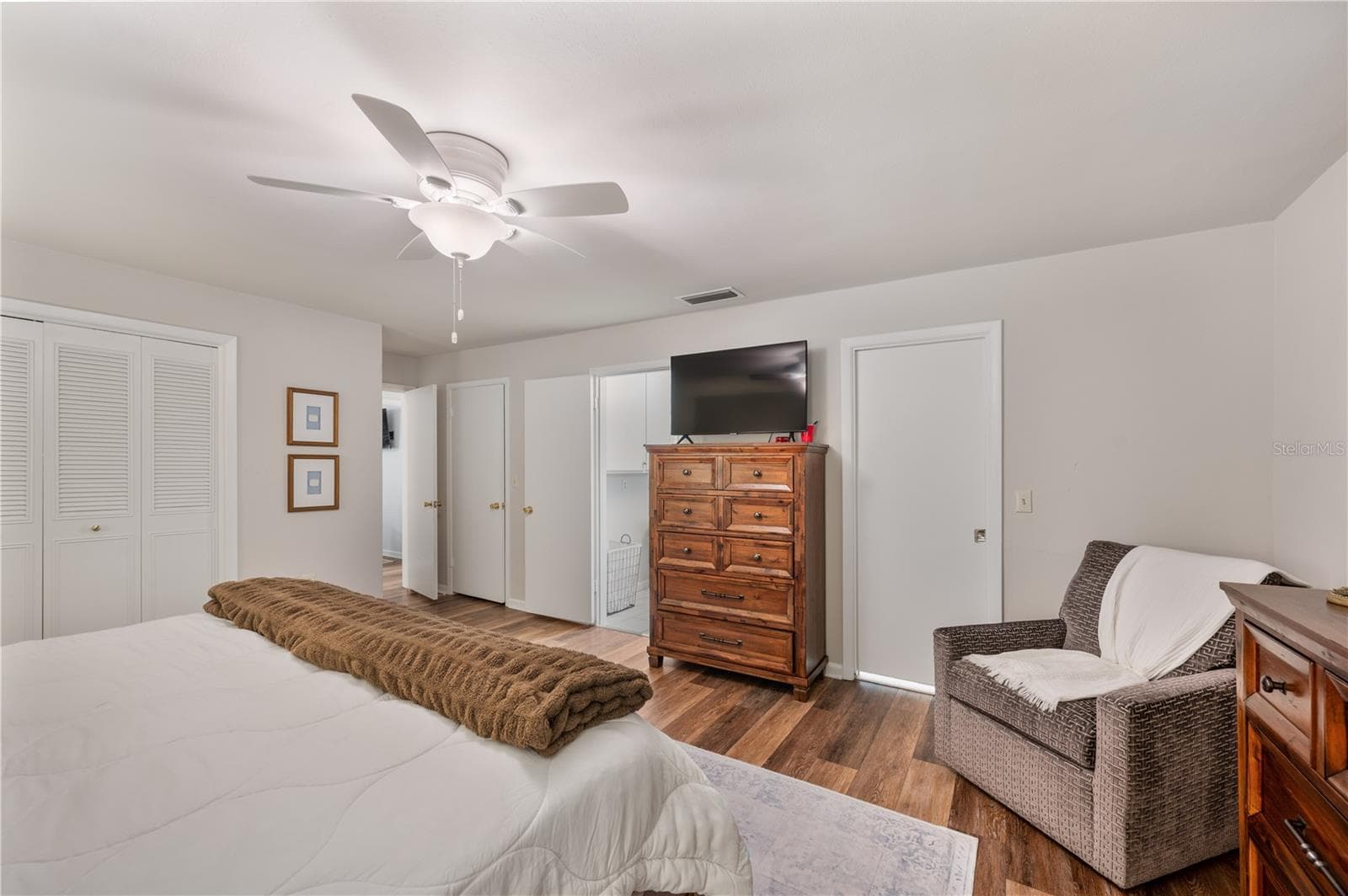 left in the photo are His & HER closets and the entrance to the Primary en-suite bathroom - 1211 HUNT AVE, LAKELAND