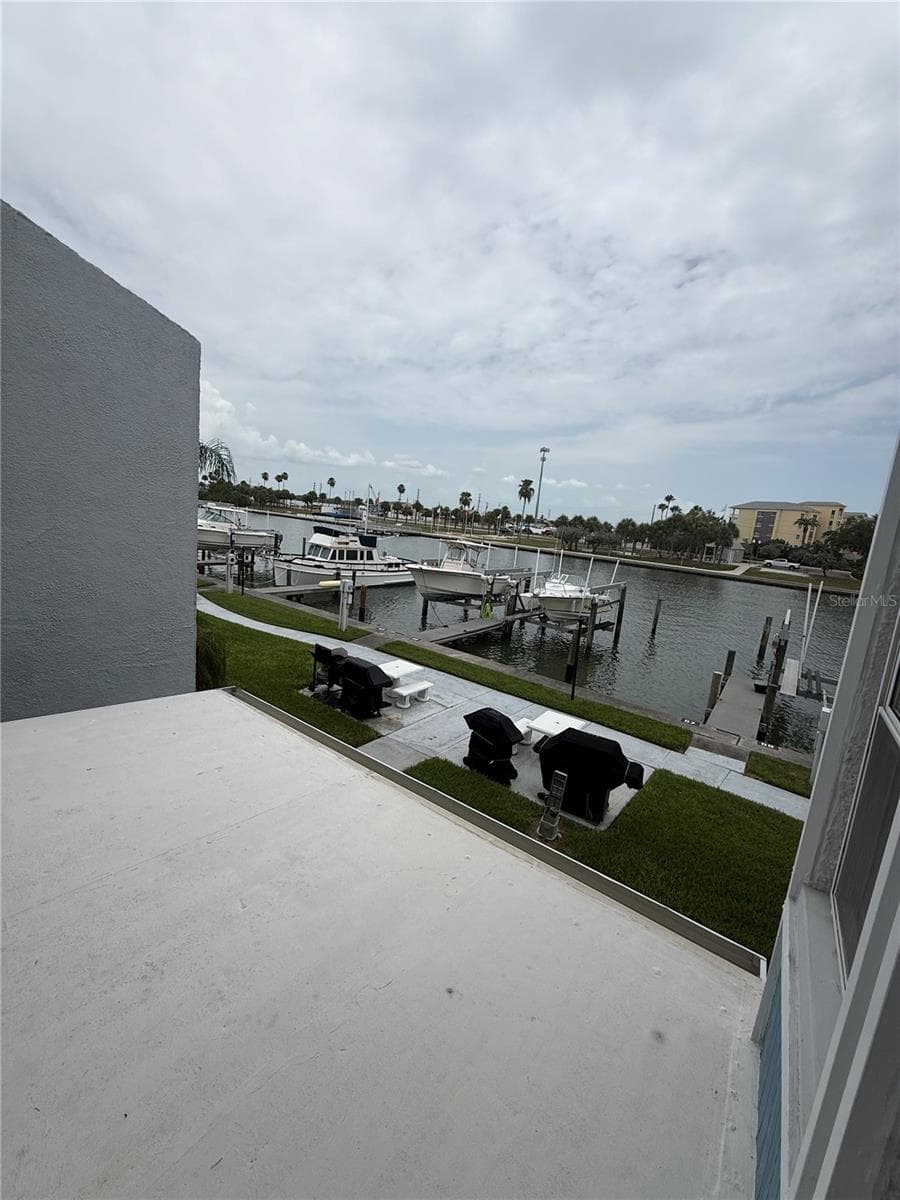 View of slip and grill from patio - 315 MEDALLION BLVD #H, MADEIRA BEACH