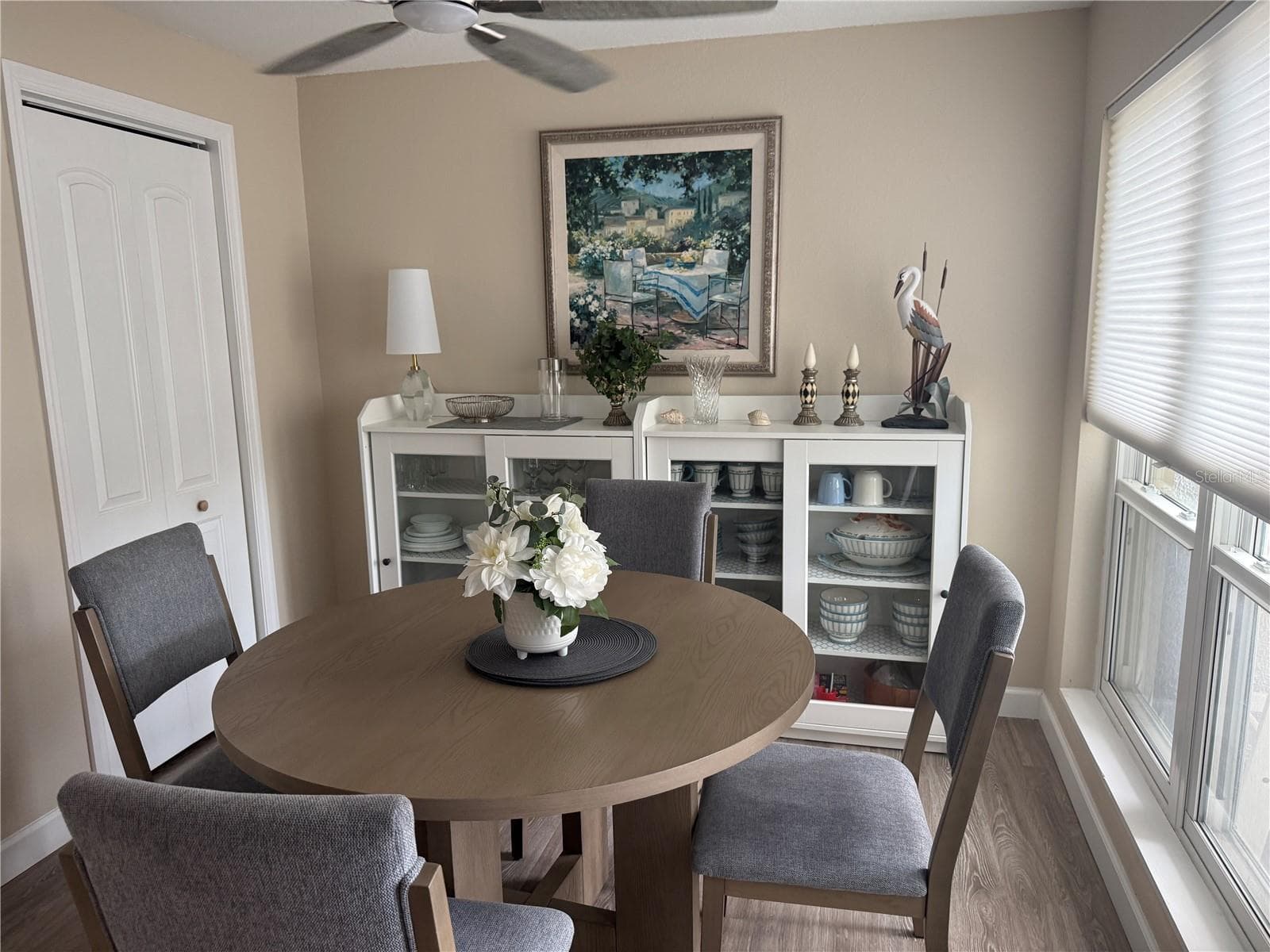 Dining room filled with natural light - 315 MEDALLION BLVD #H, MADEIRA BEACH