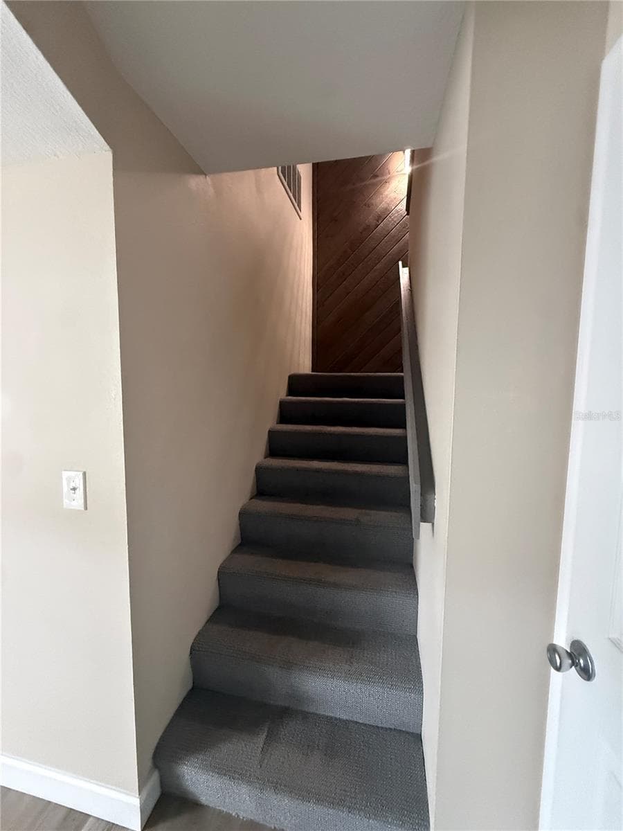 Stairway leading to the bedrooms - 315 MEDALLION BLVD #H, MADEIRA BEACH