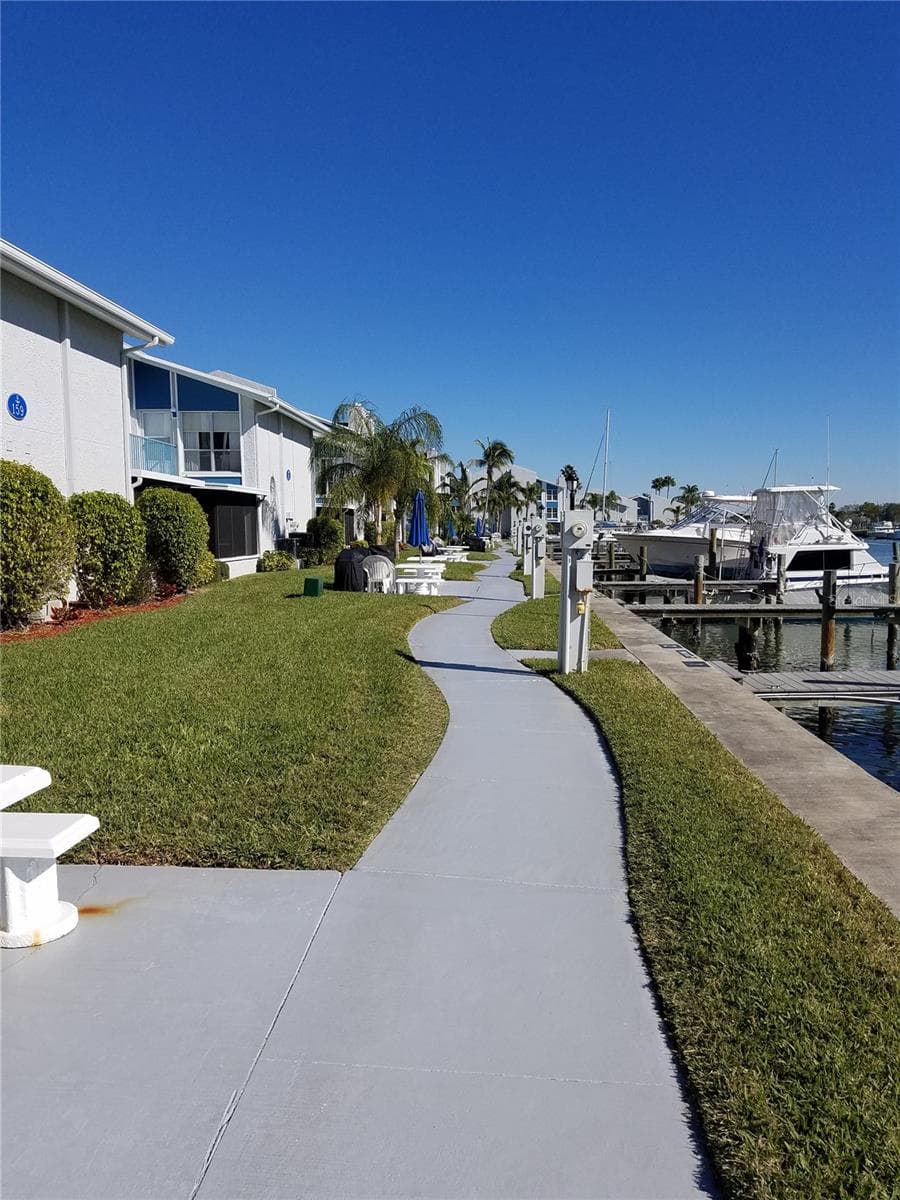 Walkway along the water - 315 MEDALLION BLVD #H, MADEIRA BEACH