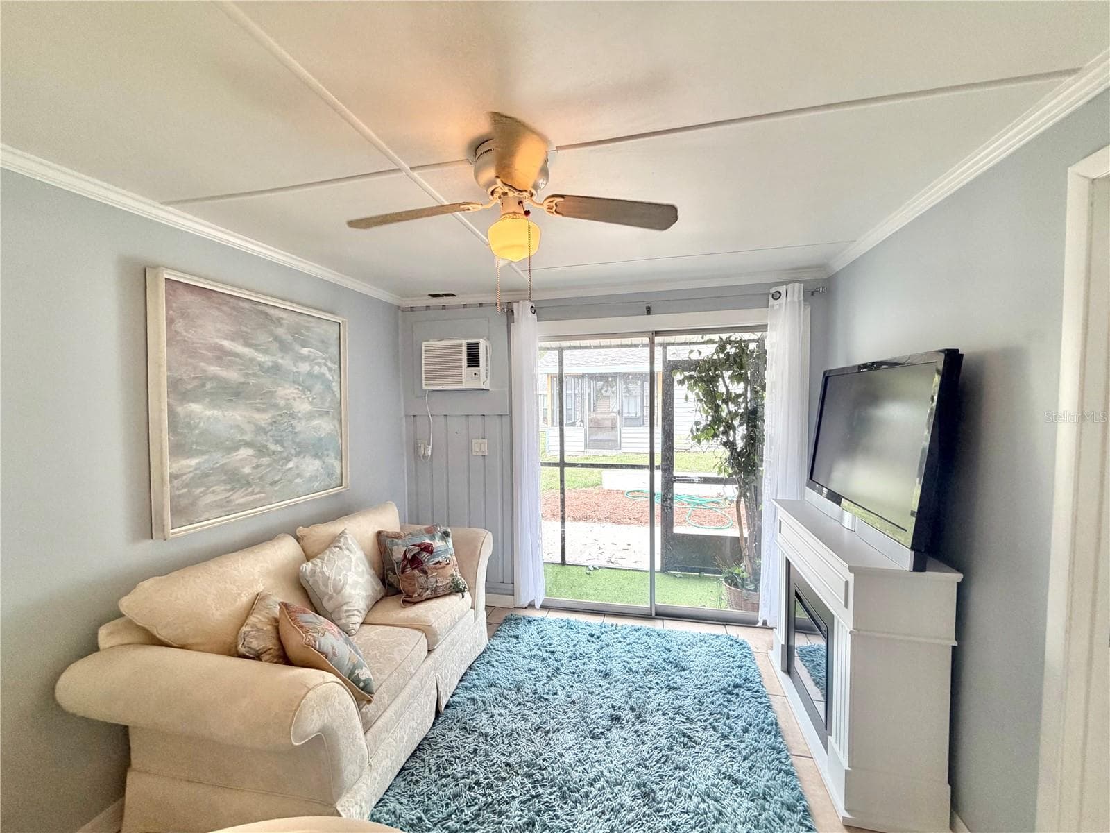 Living room with electric Fireplace - 10301 US HIGHWAY 27 #192, CLERMONT