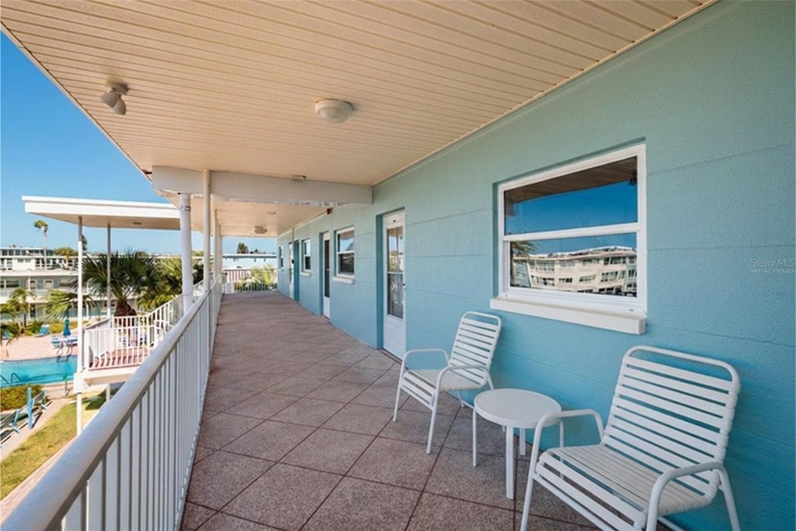 Virtually Staged. Enjoy Sunsets, Ocean breezes & swaying palm trees from your front walkway/porch. - 6061 2ND ST E #55, ST PETE BEACH