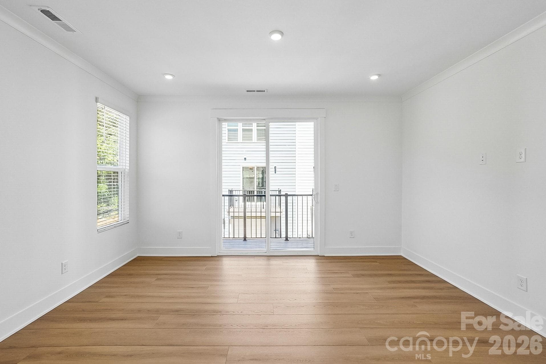 Living room with balcony access - 1139 Kokomo Lane, Charlotte
