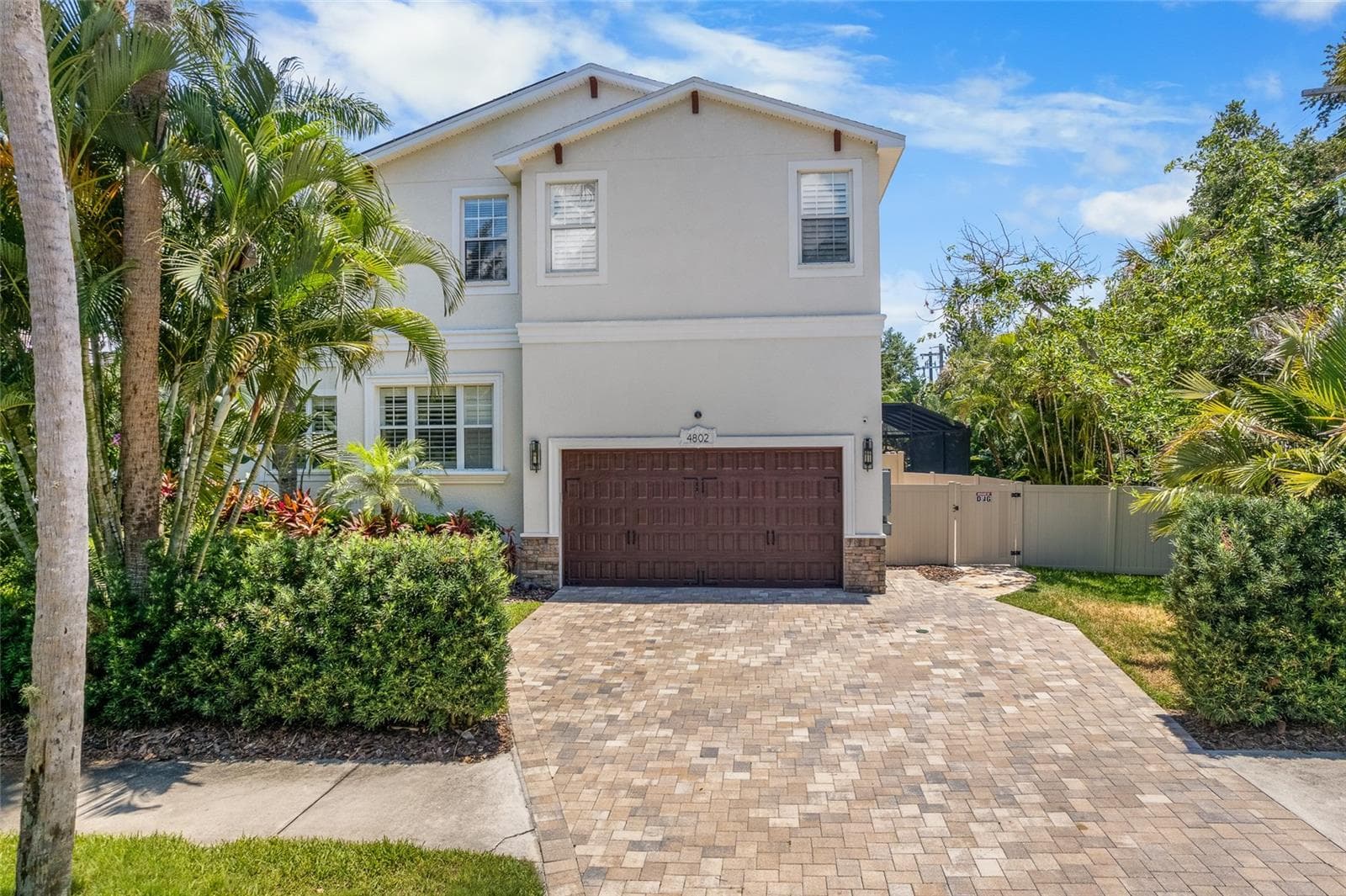 Garage entrance from the side of the house with ample space on drive way for parking - 4802 W BEACHWAY DR, TAMPA