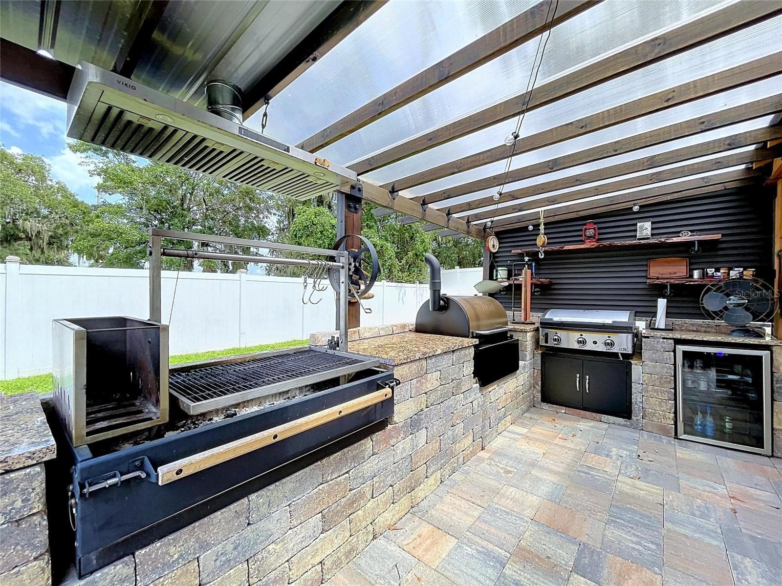 Outside entertainment area with fenced backyard - 1748 BROOKSTONE WAY, PLANT CITY