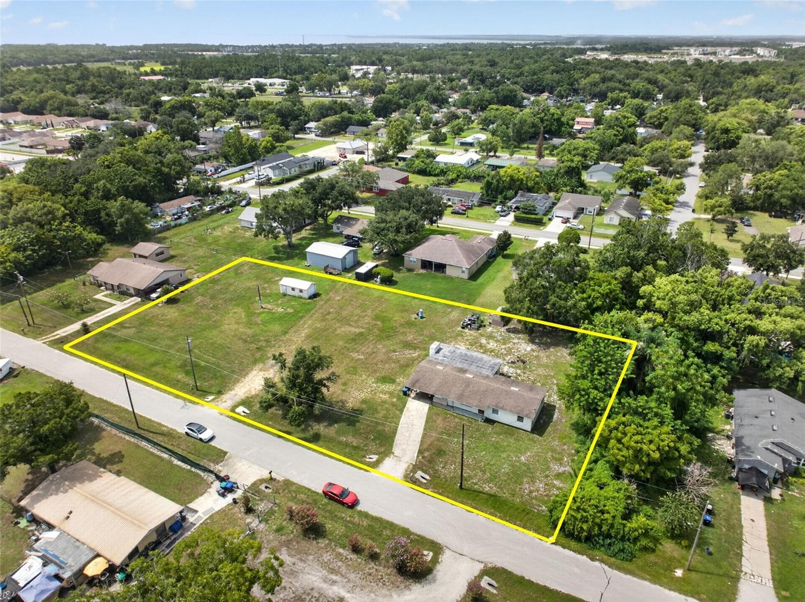 Aerial view of the parcel boundary and surrounding block. - 212 15TH AVE, OCOEE