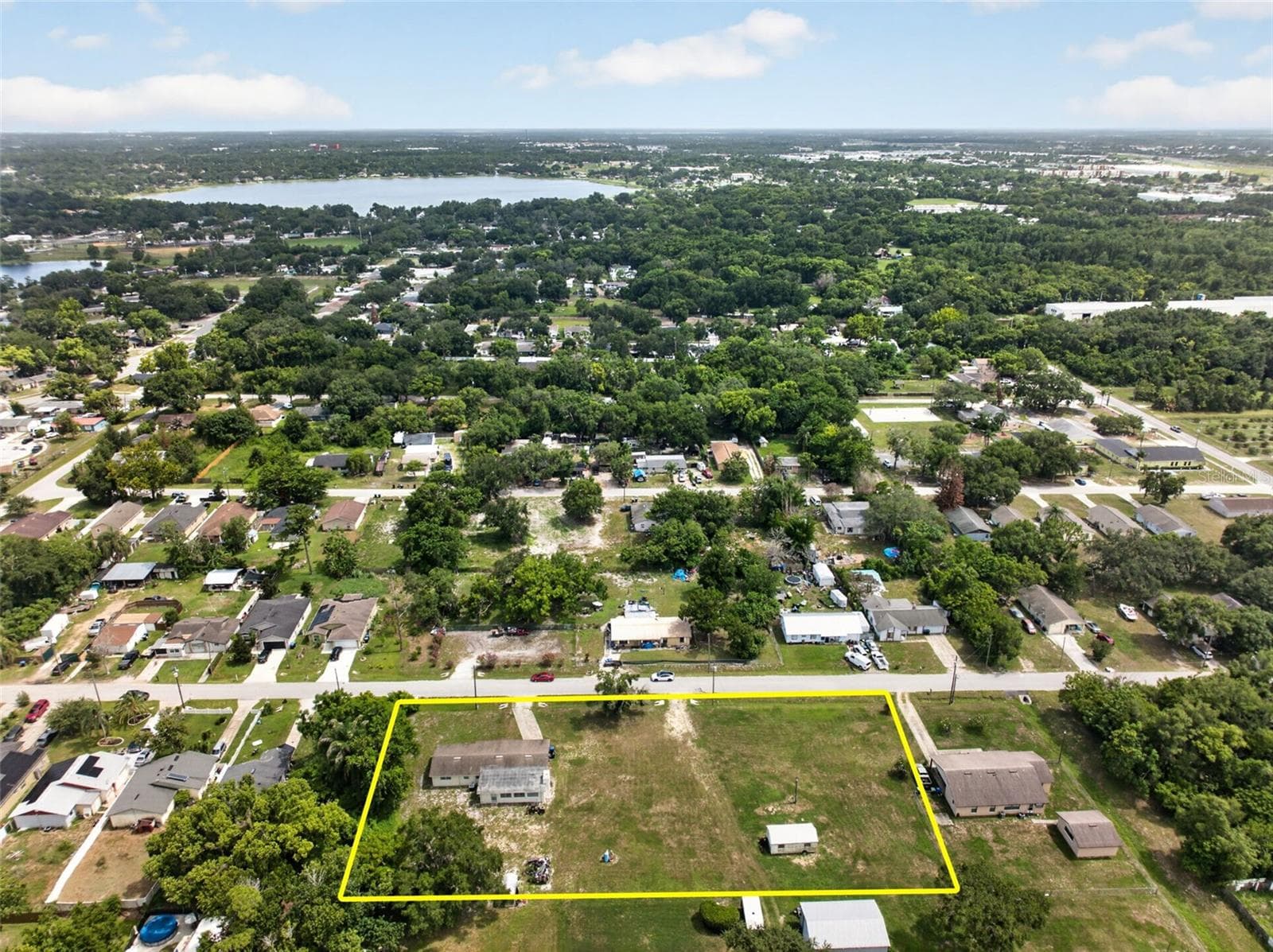 Aerial view of the parcel boundary and surrounding block. - 212 15TH AVE, OCOEE